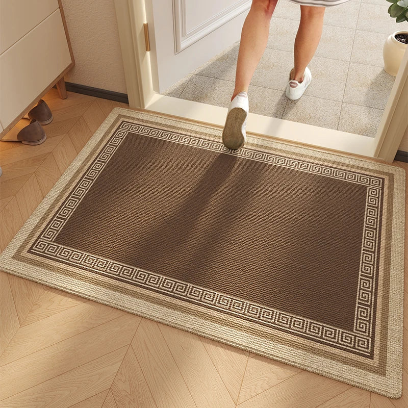 Tapis d'entrée placé à l'interieur couleur marron et beige